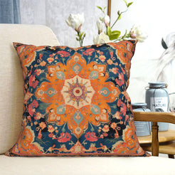 short-pile plush polyester pillow cover with orange floral medallion on navy, shown on a cream sofa