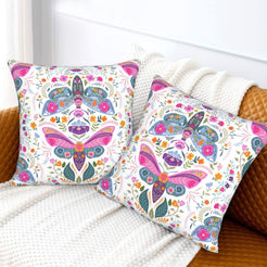 Folk butterfly velvet pillow covers with white folk butterfly medallions, styled on a sofa