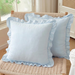 Set of two light blue solid cotton pillow covers with ruffled edges
