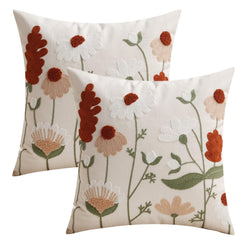 Set of two embroidered polyester canvas pillow covers with rust, cream and green embroidered wildflowers