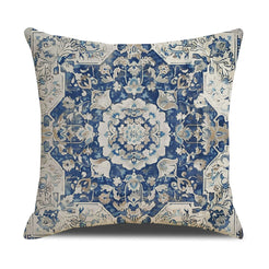 Linen-look polyester pillow cover with blue floral medallion and ornate border, shown on white