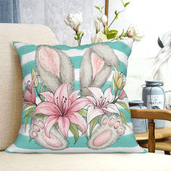 Teal bunny and lily short-pile plush Easter pillow cover styled on a chair