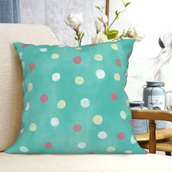 Teal polka dot short-pile plush Easter pillow cover styled on a chair