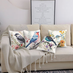 short-pile plush polyester pillow covers with colorful birds among flowers and berries, styled on a cream sofa