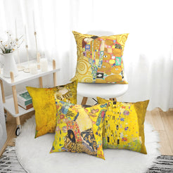 velvet polyester pillow covers with gold Art Nouveau portraits and mosaic patterns, arranged beside a white chair