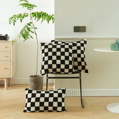 Black and white checkerboard faux fur square and lumbar pillow covers