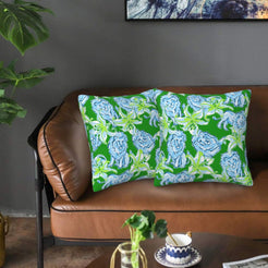 Velvet pillow covers with green and blue tigers with flowers, styled on a sofa