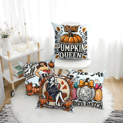 Four light blue fall pillow covers with Pumpkin Queen and retro fall designs, styled on a bench