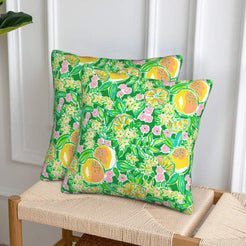 Velvet pillow covers with green mixed fruit and flowers, styled on a sofa