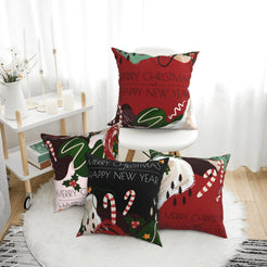 Short-pile plush pillow covers with red and green abstract Christmas motifs, styled in a bright room