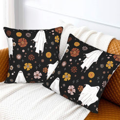Halloween velvet pillow covers with black ghosts, bats and flowers, styled on a sofa