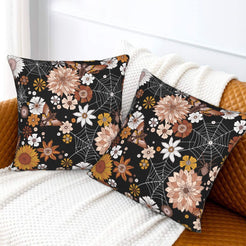 Halloween velvet pillow covers with black spiderwebs and dahlias, styled on a sofa