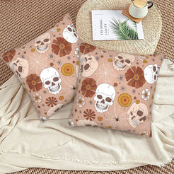 Halloween velvet pillow covers with blush skulls and flowers, styled on a woven chair