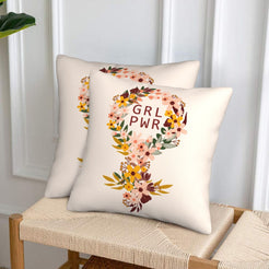 Velvet pillow covers with girl power floral symbol, styled in a living room