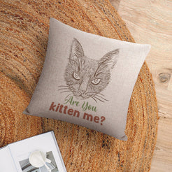 Linen-look pillow cover with cat and Are You Kitten Me quote, shown in a flat lay