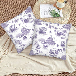 Mardi Gras velvet pillow covers with New Orleans landmarks in purple toile on white, styled on a floor cushion