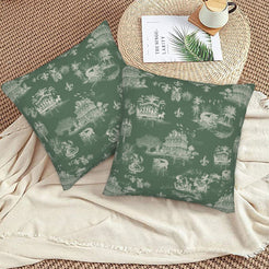Mardi Gras velvet pillow covers with New Orleans toile in pale green on dark green, styled on a floor cushion