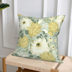 Sage white-flower short-pile plush pillow cover styled on a woven chair