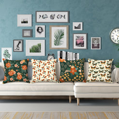 Green floral and butterfly pillow covers styled on a white sectional sofa