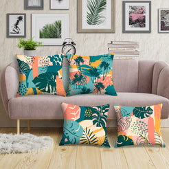 Short-pile plush pillow covers with coral, teal and mustard tropical leaves, styled around a pale pink sofa