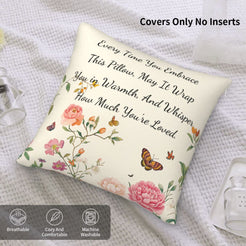Velvet pillow cover with cream floral pattern and heartfelt love quote on a bed with cover-only note