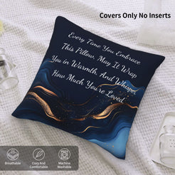 Velvet pillow cover with navy blue marble pattern and heartfelt love quote on a bed with cover-only note