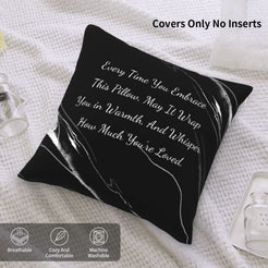 Velvet pillow cover with black marble pattern and heartfelt love quote on a bed with cover-only note