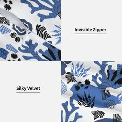 Hidden zipper and velvet detail on a pillow cover with blue coral garden motifs