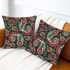 Velvet pillow covers with small red and teal paisley, styled on a white sofa