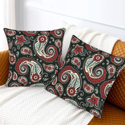 Velvet pillow covers with red and green paisley, styled on a white sofa