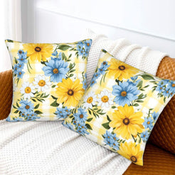 Velvet pillow covers with sunflowers and blue daisies on yellow gingham, styled on a bed