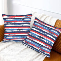 4th of July velvet pillow covers with red, white and blue brushstroke stripes, styled on a sofa