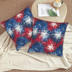 4th of July velvet pillow covers with red, white and blue fireworks, styled on a woven chair