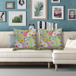 Water-resistant pillow covers with sage multicolor wildflowers, styled on a white sofa