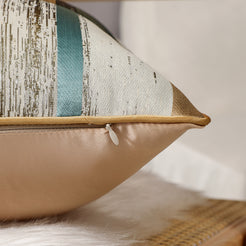 Close-up of teal, beige and gold patchwork jacquard fabric with hidden zipper