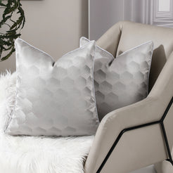 Silver honeycomb jacquard pillow covers styled on an armchair