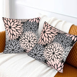Black, blush and gray dahlia pattern velvet pillow covers styled on a sofa