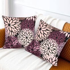Black, blush and plum dahlia pattern velvet pillow covers styled on a sofa