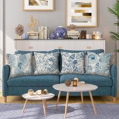 water-resistant linen-look polyester pillow covers with blue seashell and octopus prints, styled on a teal sofa