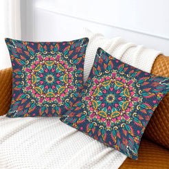 Navy teal and coral floral mandala design velvet pillow covers styled on a sofa