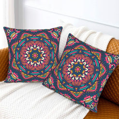 Navy orange and pink star mandala design velvet pillow covers styled on a sofa