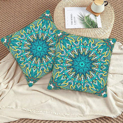 Turquoise and lime radial mandala design velvet pillow covers styled on a woven chair