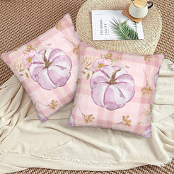 Autumn velvet pillow covers with pink plaid pumpkin, styled on a woven chair