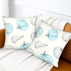 Autumn velvet pillow covers with cream blue and gray pumpkins, styled on a sofa