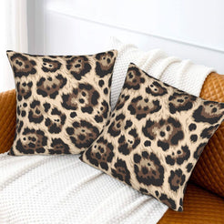 Velvet pillow covers with taupe abstract leopard spots, styled on a white sofa