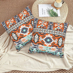 Bohemian velvet pillow covers with rust and teal tribal medallions, styled on a floor cushion
