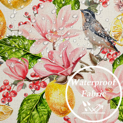 Close-up of water-resistant linen-look polyester with birds, lemons and pink flowers
