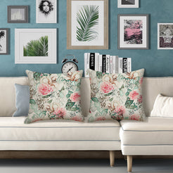 Outdoor water-resistant linen-look polyester pillow covers with pale pink roses, styled on a white sofa