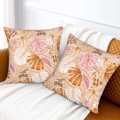 Bohemian floral velvet pillow covers with beige blush tropical leaves, styled on a sofa