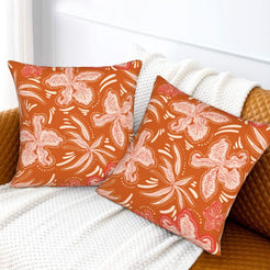 Bohemian floral velvet pillow covers with rust pink botanical pattern, styled on a sofa